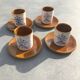 4 ceramic cups and saucers