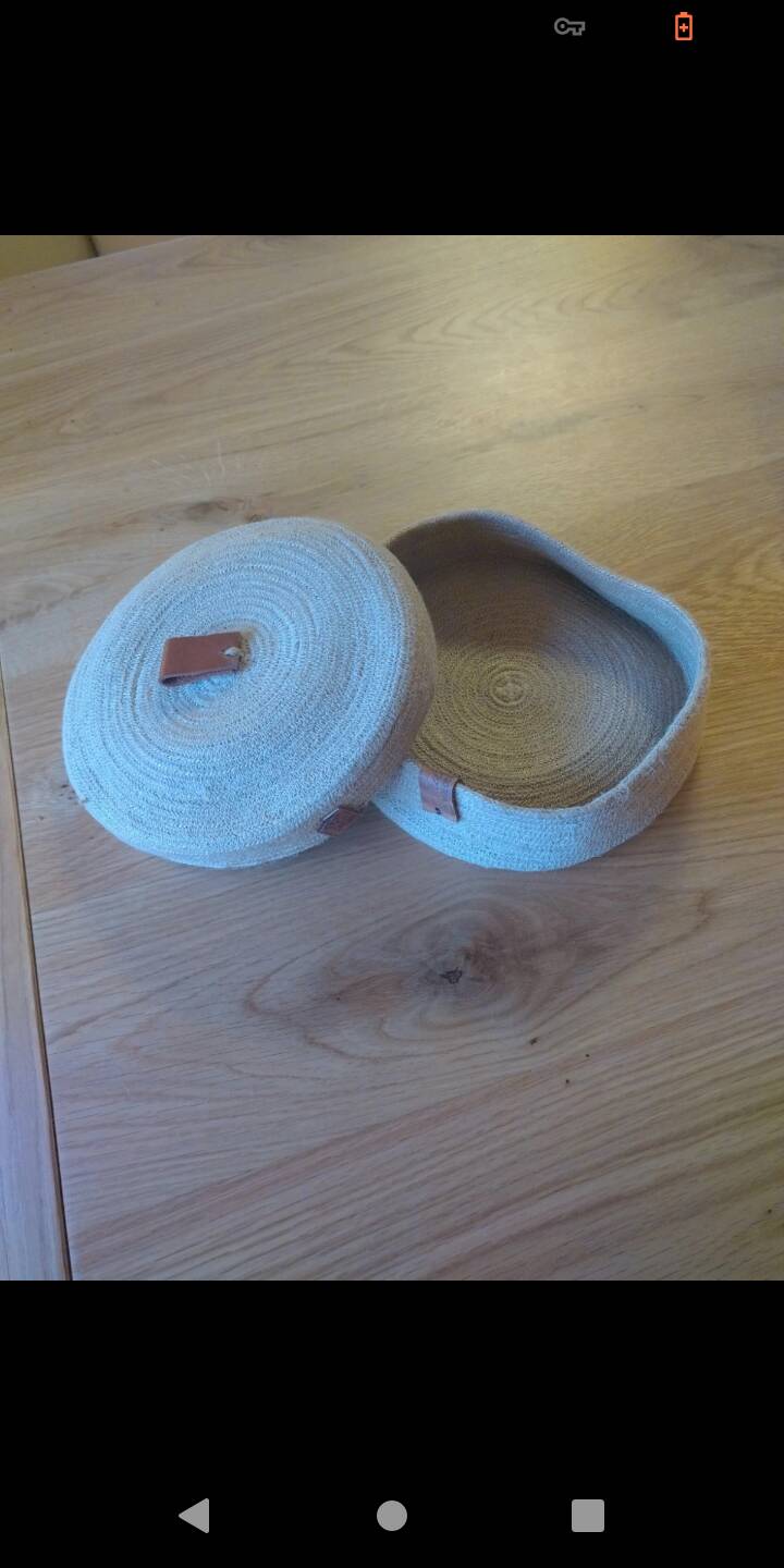 Basket with braided rope and leather lid