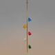 Tubular pendant light in patinated and lacquered brass. Contemporary