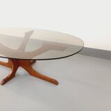 Vintage Hugues Poignant oval coffee table in teak and smoked glass from the 1970s