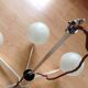 Six-light chrome metal chandelier and opaque glass globes / vintage 60s and 70s