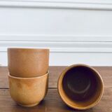 Three sandstone cups without handles
