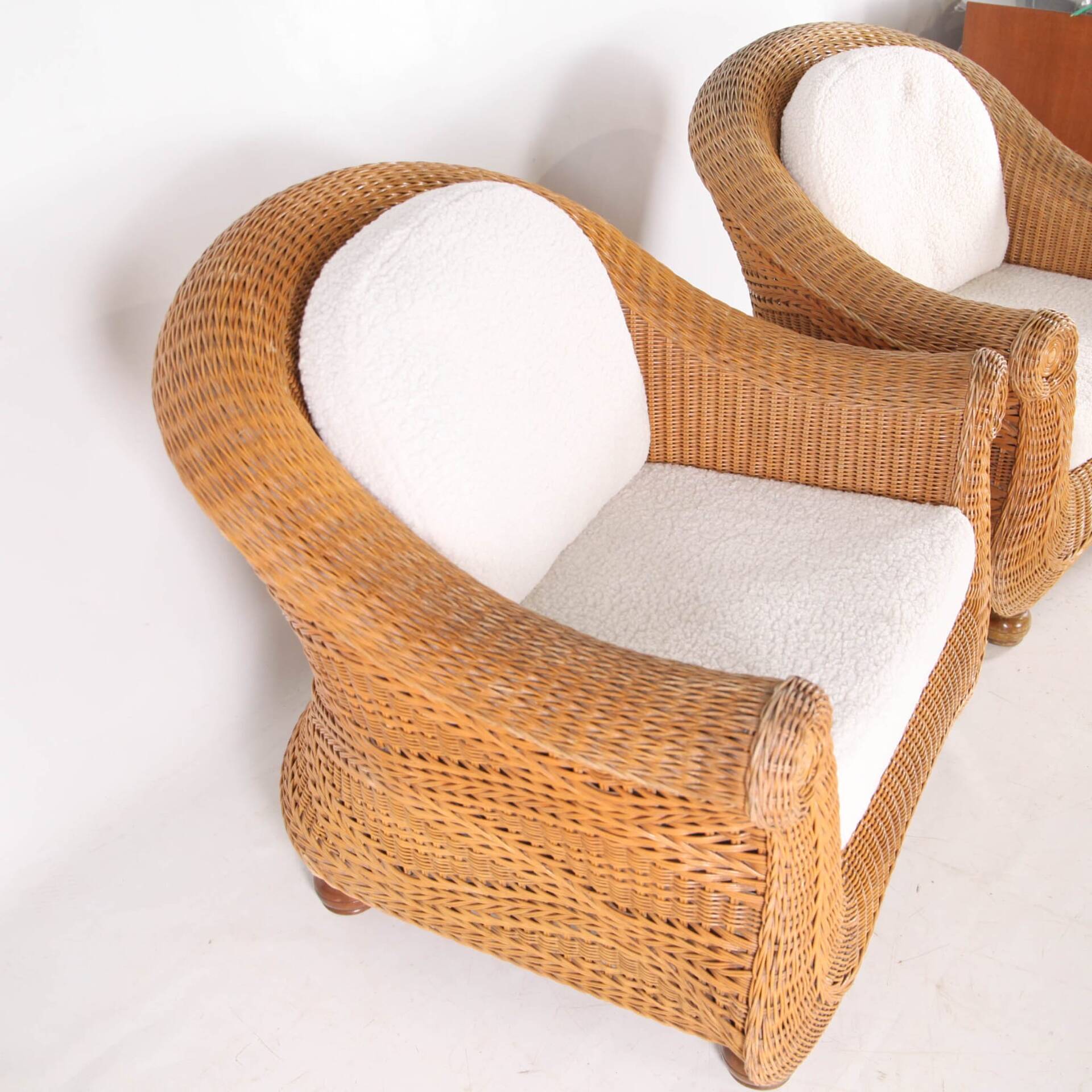 Pair of woven wicker armchairs