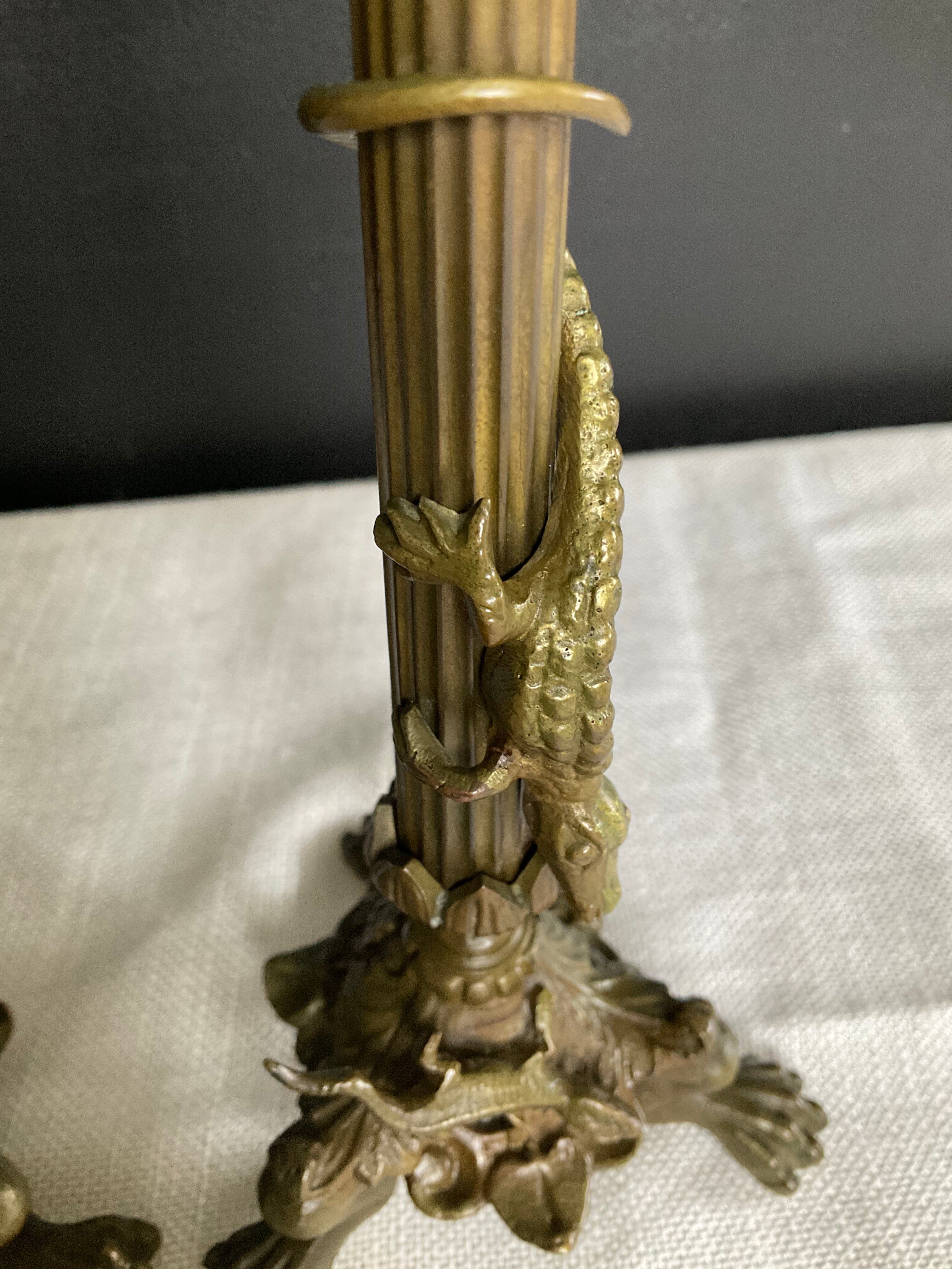 Pair of 19th-century gilded bronze candlesticks in Empire style.