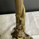 Pair of 19th-century gilded bronze candlesticks in Empire style.