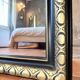 Louis-Philippe black and gold antique mirror from the 19th century