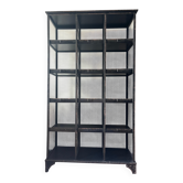 Black metal shelf with compartments.