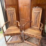 Pair of Renaissance style carved walnut armchairs