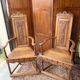 Pair of carved walnut armchairs in Renaissance style