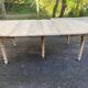 Renovated Louis Philippe round extendable dining table with 4 leaves.