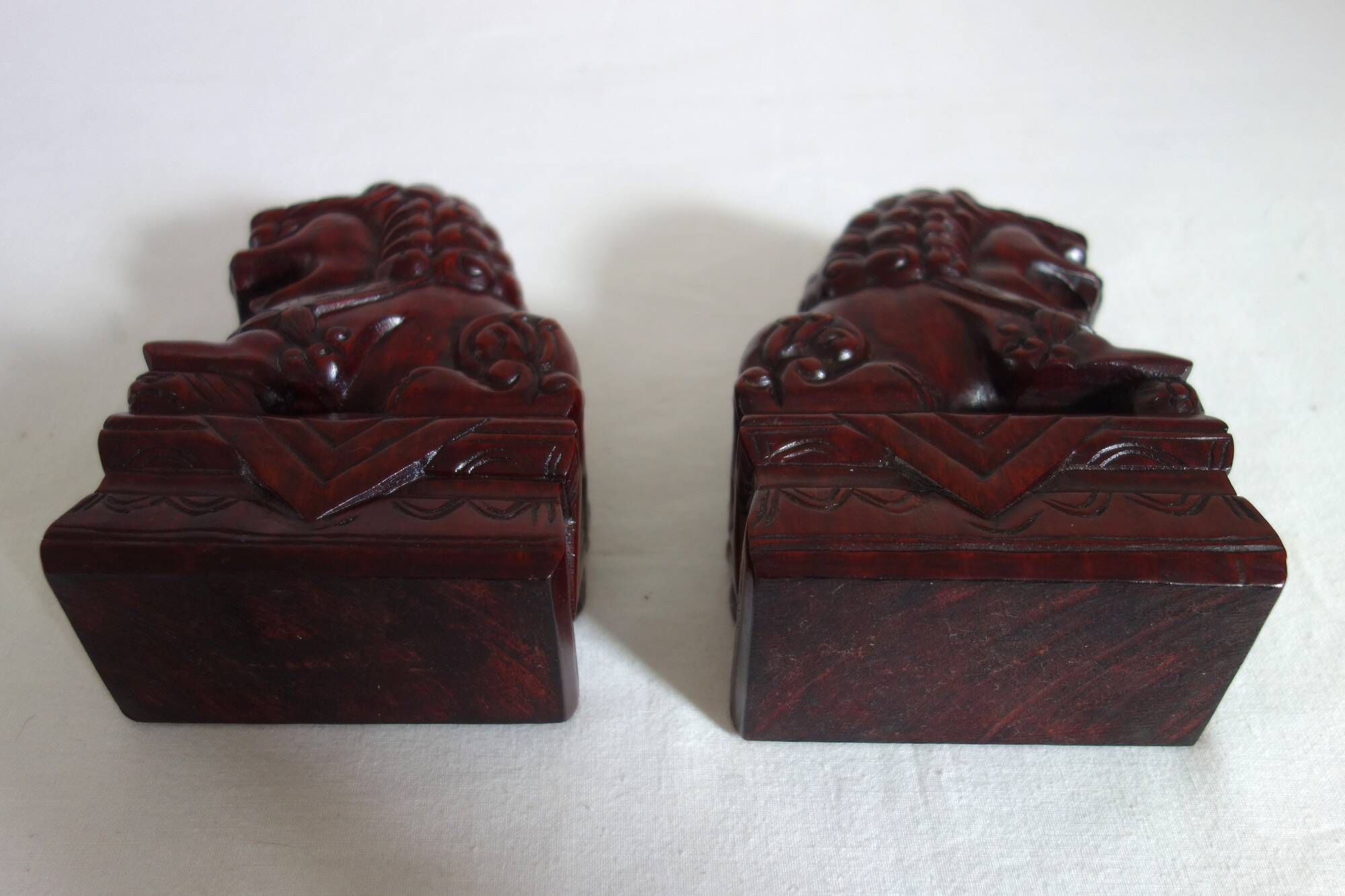 Vintage wooden pair of Foo dogs.