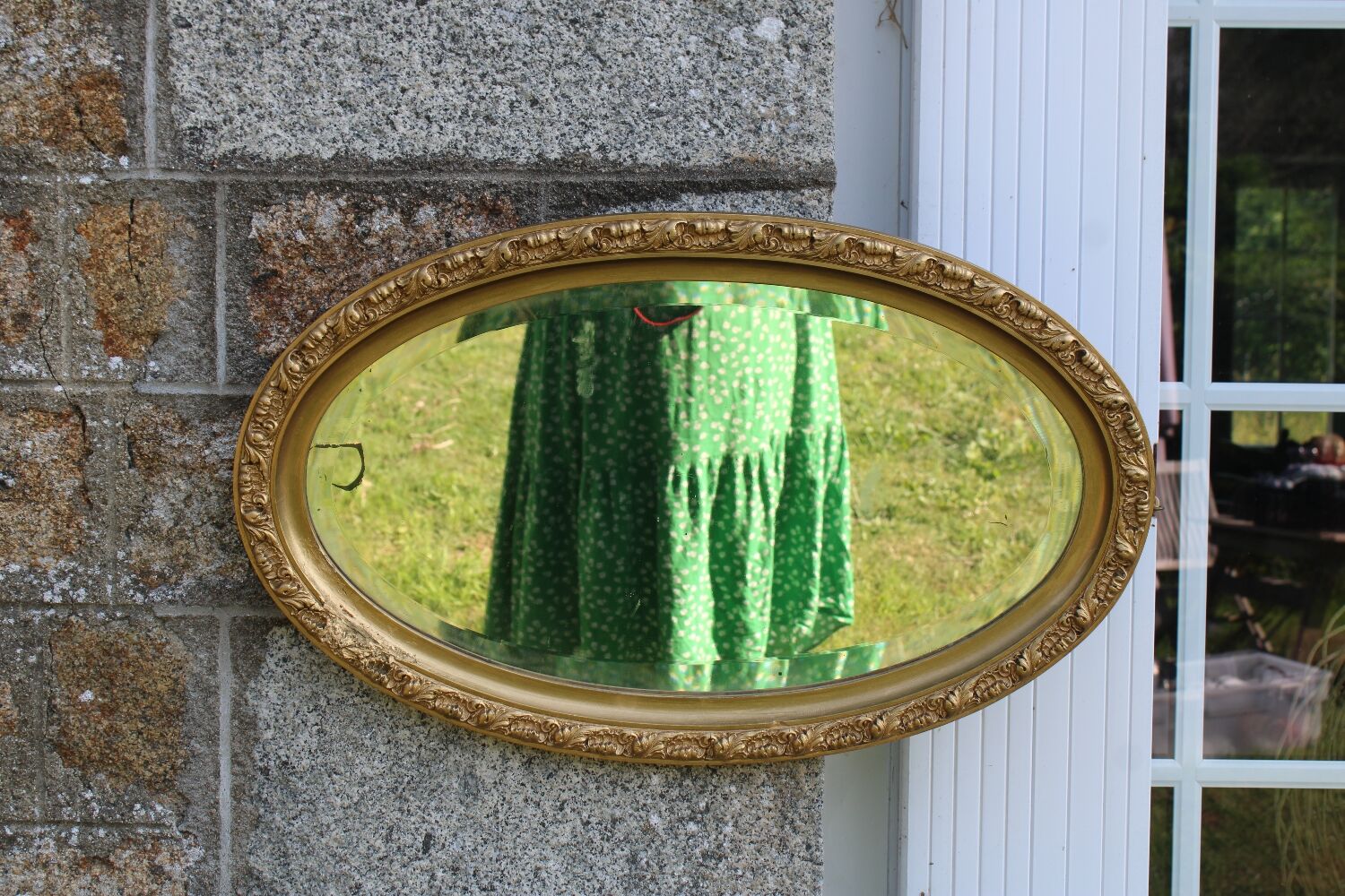 Bevelled oval antique mirror