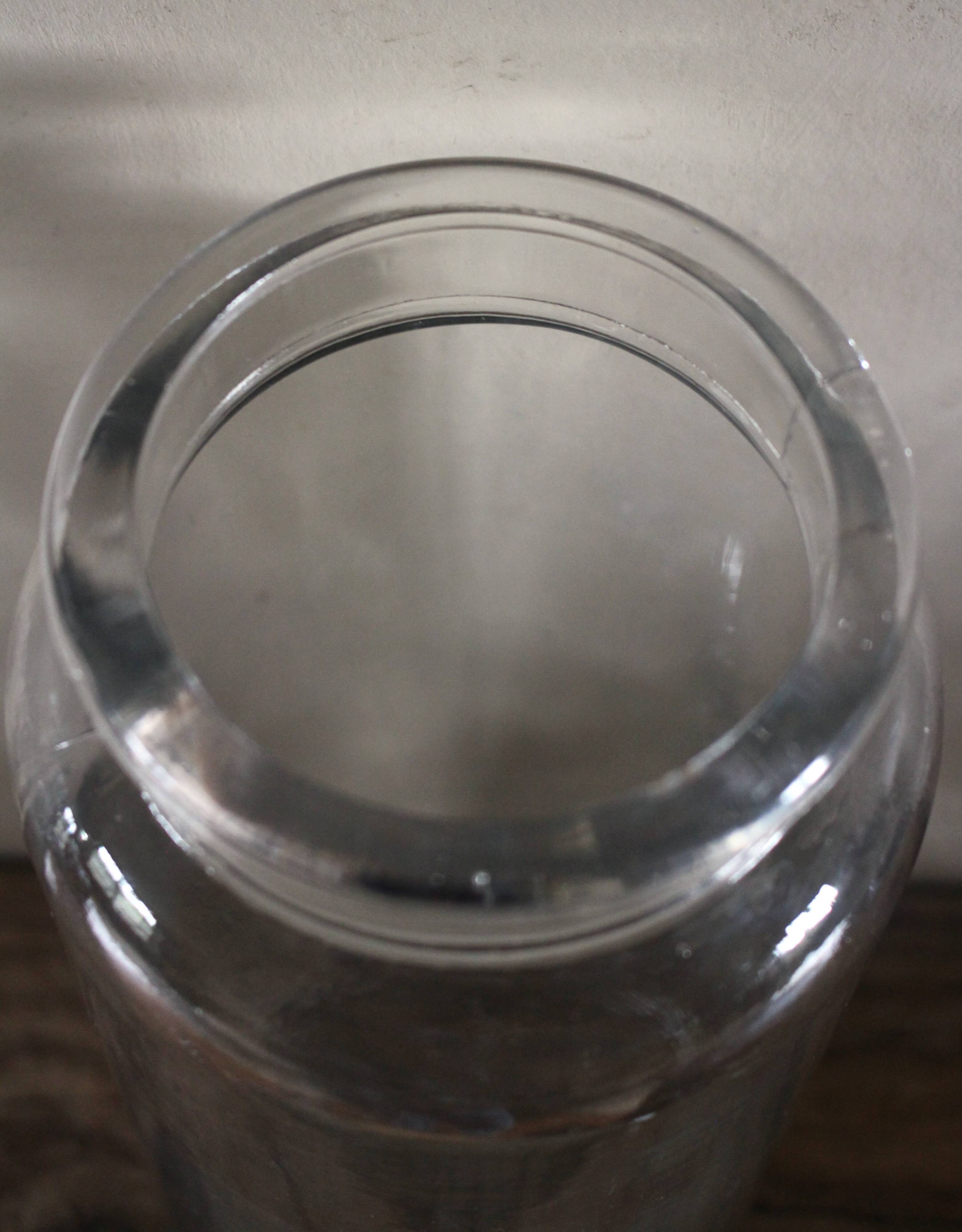 Large antique transparent glass bottle vase