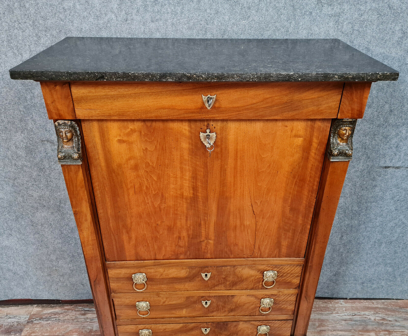 Secretary empire era with caryatid in blond mahogany around 1810