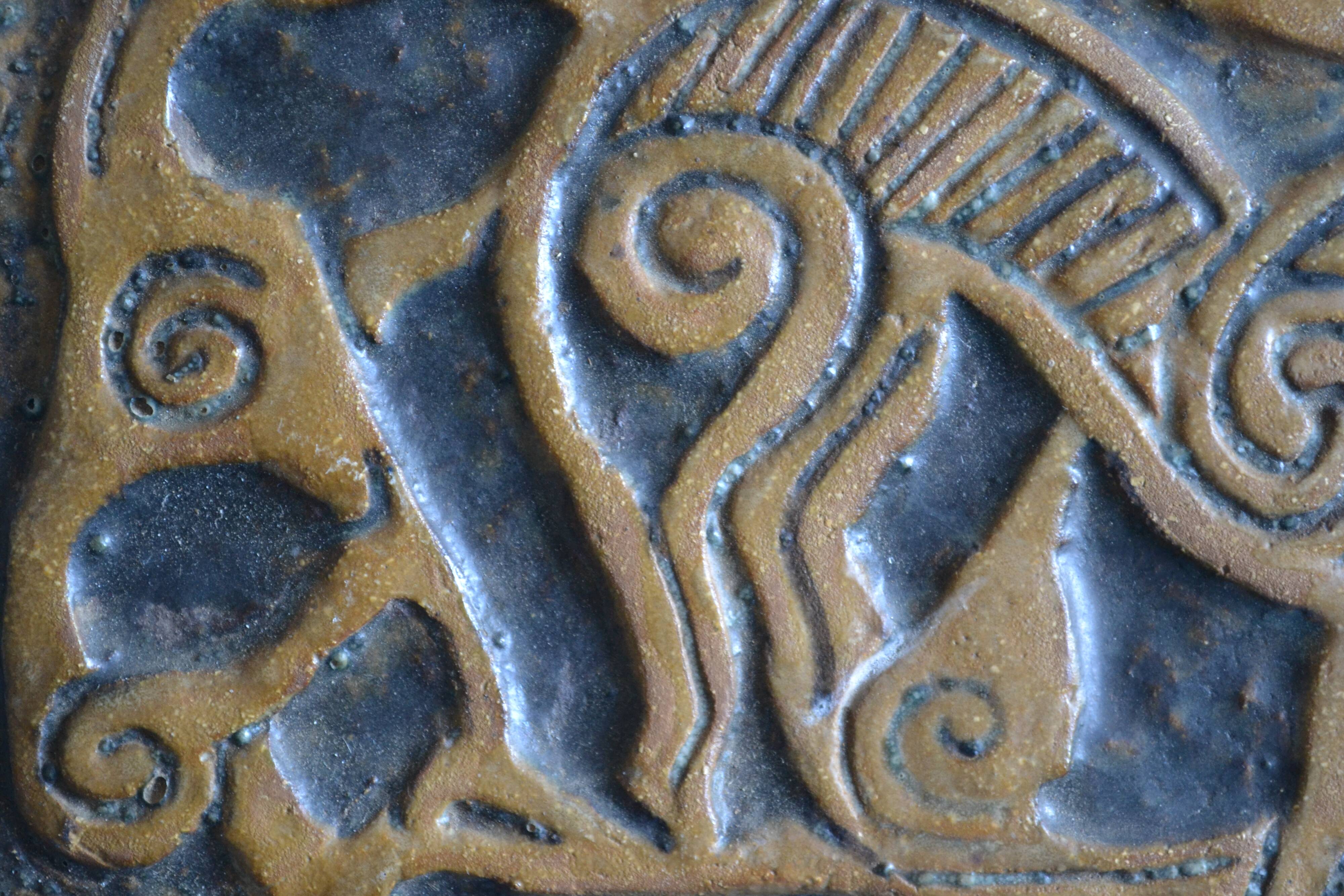 Bas-relief sculpture in terracotta inspired by the Celtic bestiary
