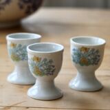 Vintage white porcelain egg cups with floral pattern