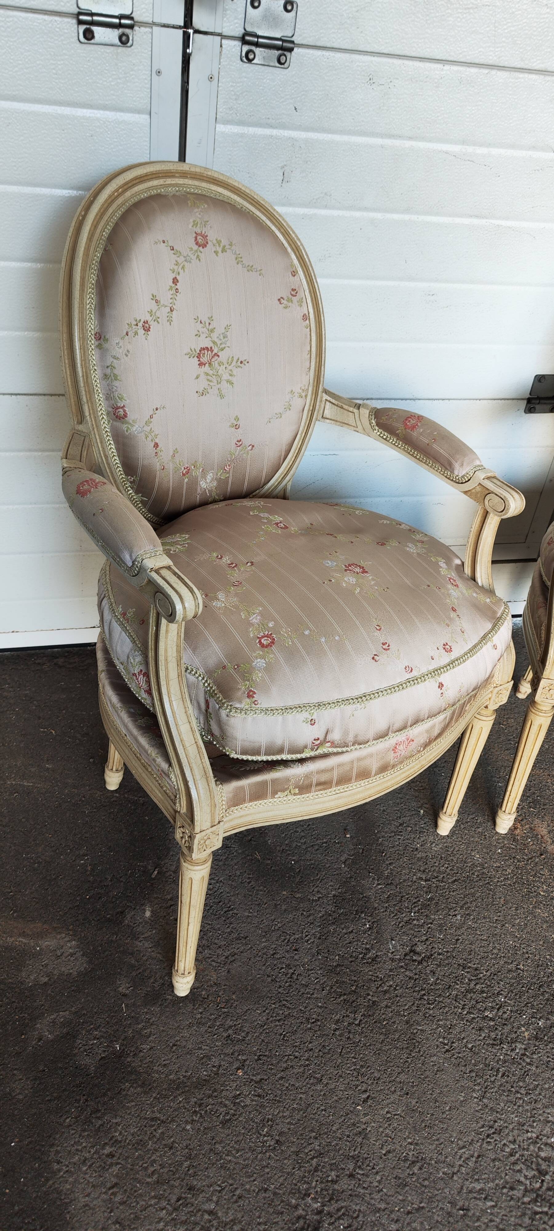 Old pair of Louis XVI style armchairs
