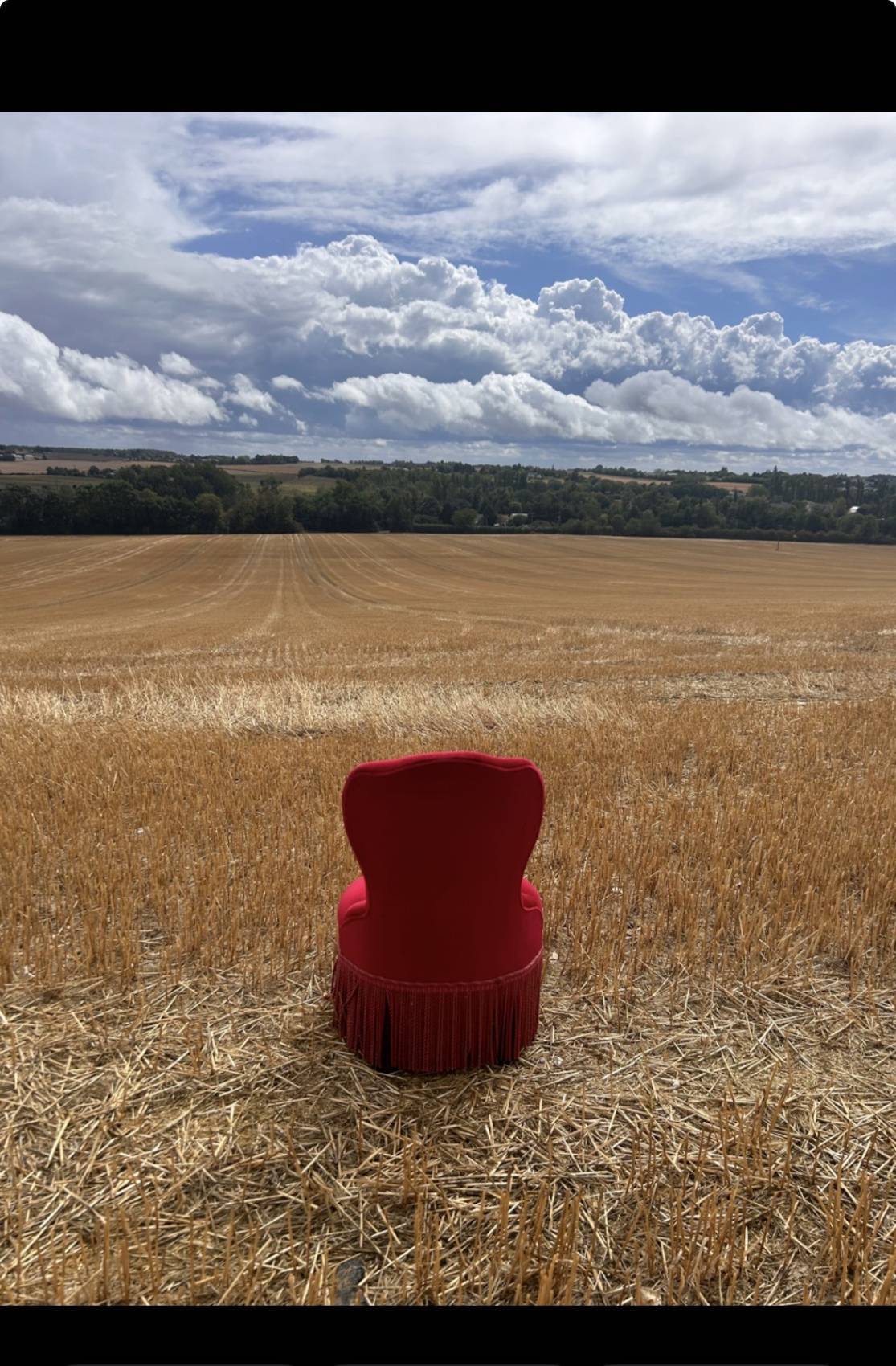 Vintage burgundy velvet armchair with fringes – theatrical and elegant