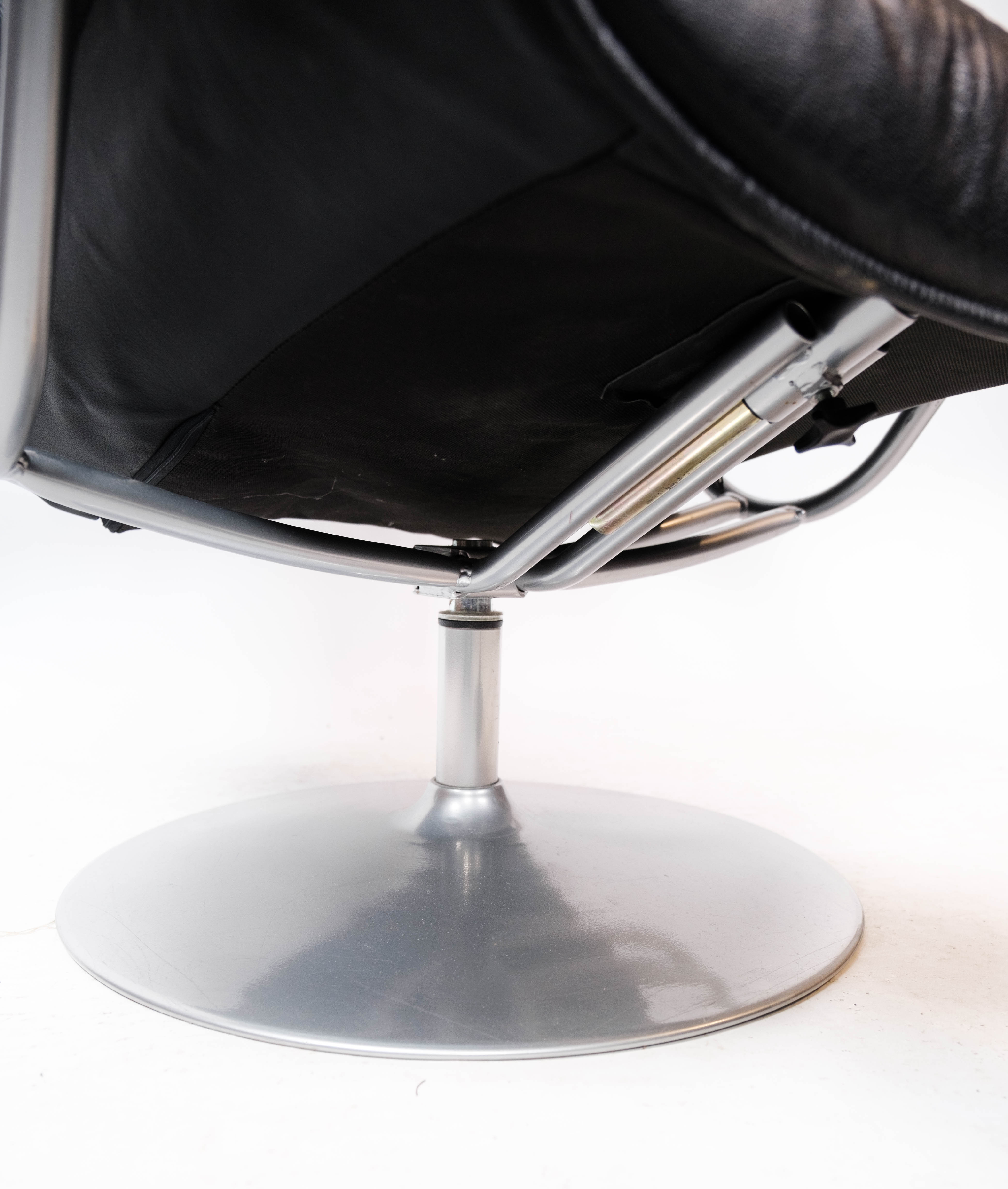 Easy chair with stool upholstered with black leather of Danish design, 1970s