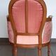 Pair of Louis XVI style armchairs in walnut and pink silk and ecru