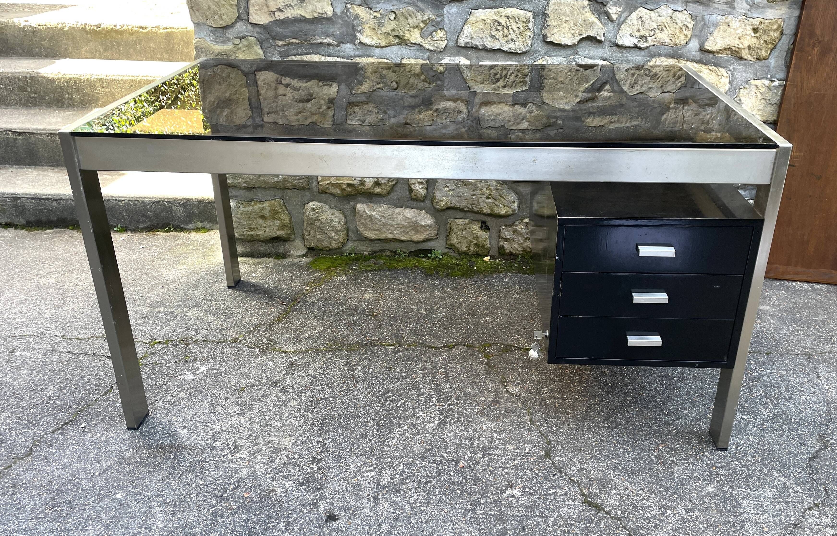 Vintage desk in smoked glass and brushed steel. 1970. Suspended box