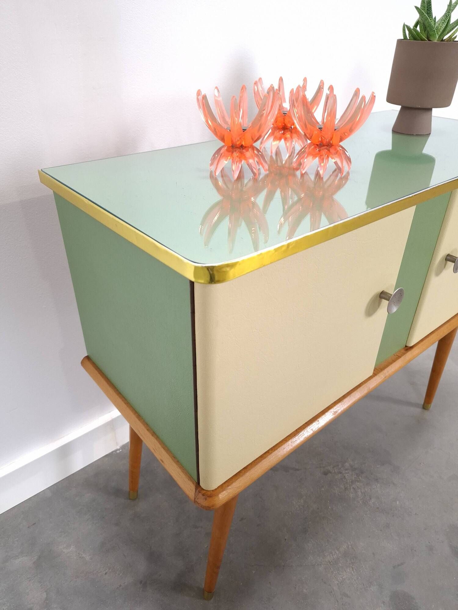 Vintage green DDR cabinet, model Libelle with glass top, slanted legs.