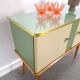 Vintage green DDR cabinet, model Libelle with glass top, slanted legs.