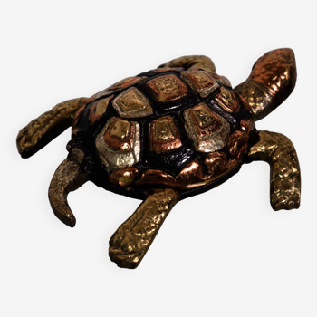 Golden brass turtle in decorative ashtray