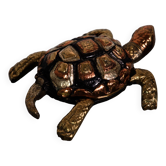 Golden brass turtle in decorative ashtray