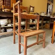 High chair made of wood and straw.