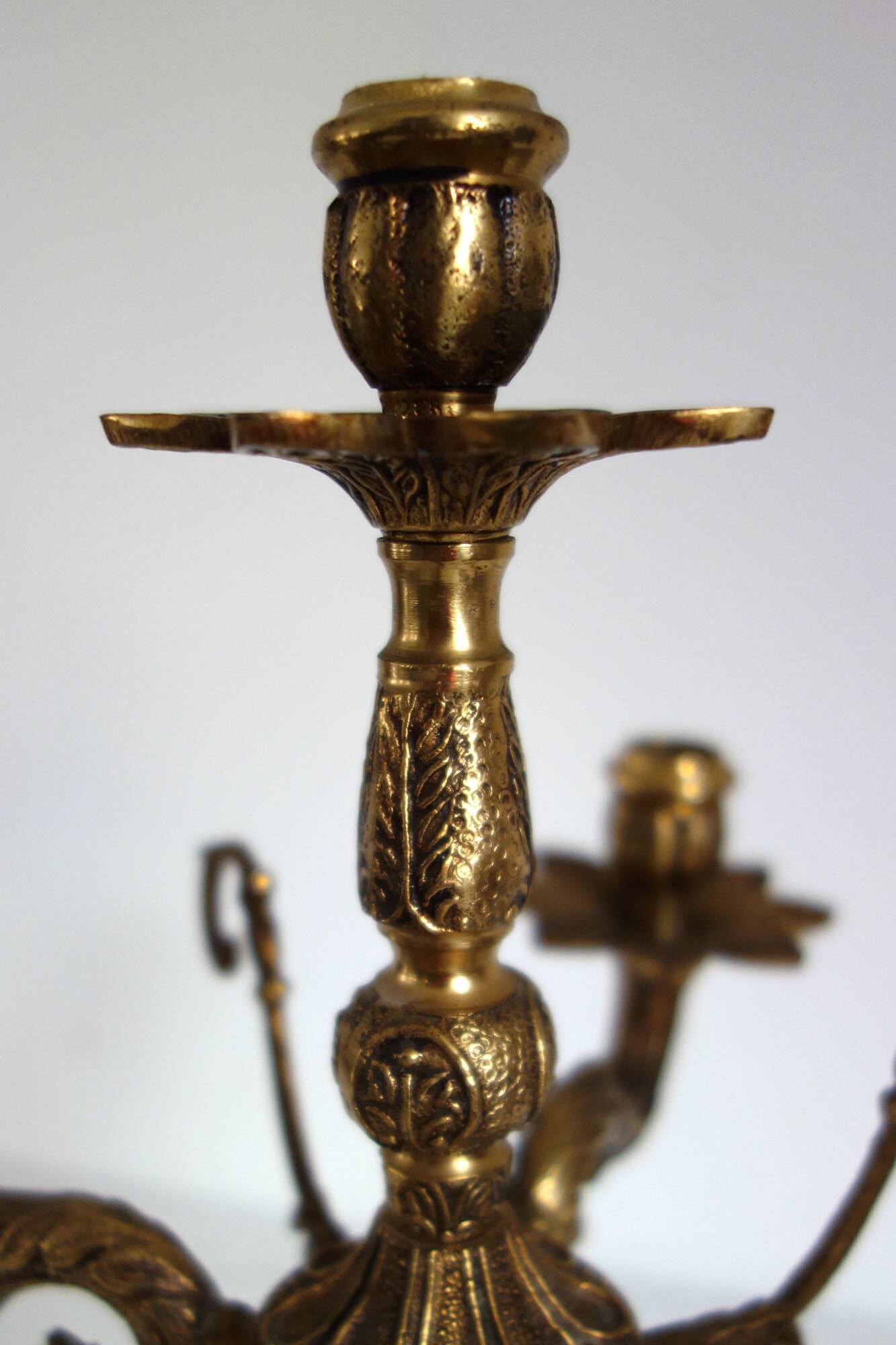 Pair of cherub candle holders in gilded bronze, early 20th century.