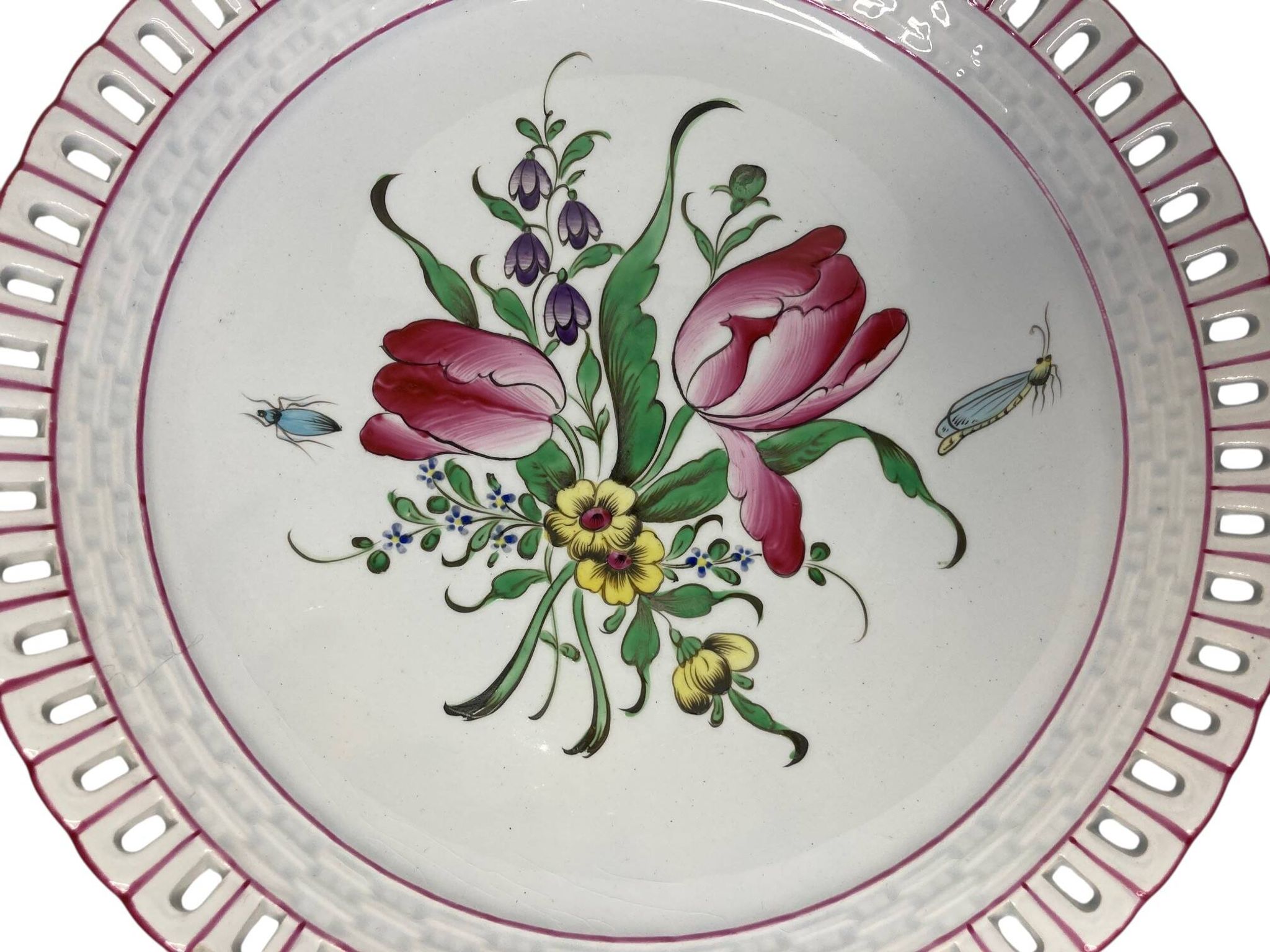 Lunéville, two floral earthenware bowls with pierced edges from the early 20th century.