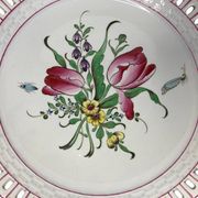 Lunéville, two floral earthenware bowls with pierced edges from the early 20th century.