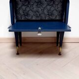 Old bedside table with compass feet