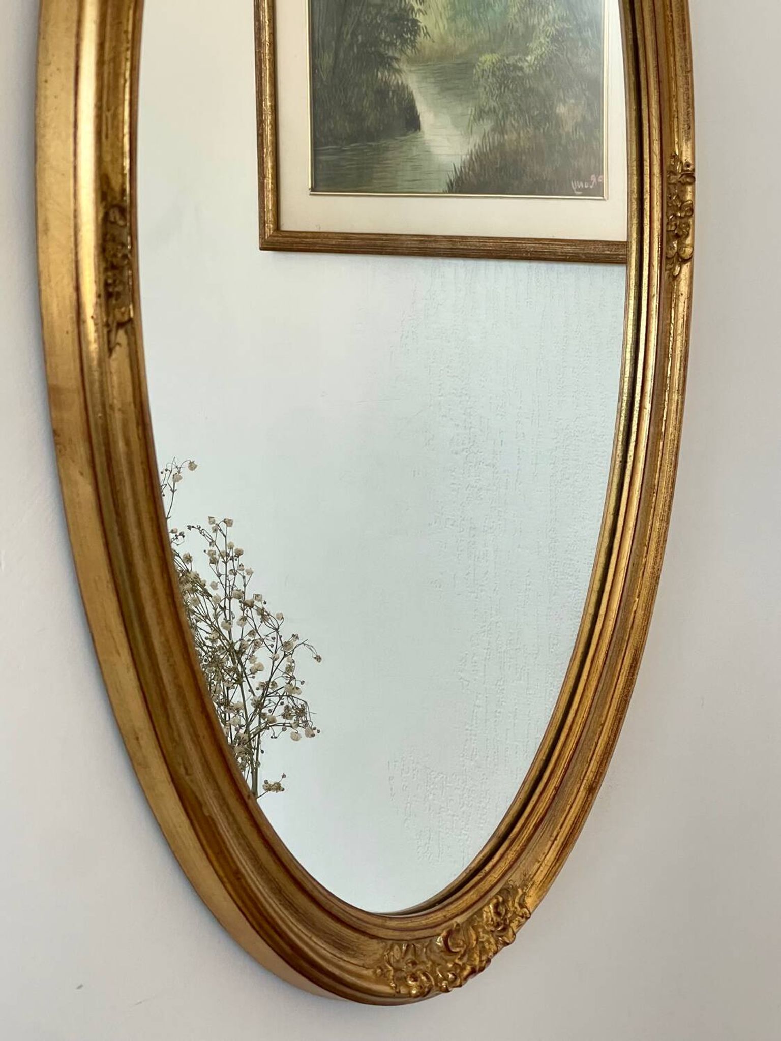 Oval mirror in carved wood