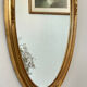 Oval mirror in carved wood