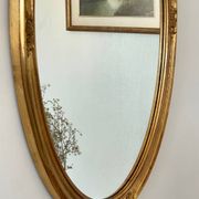 Oval mirror in carved wood