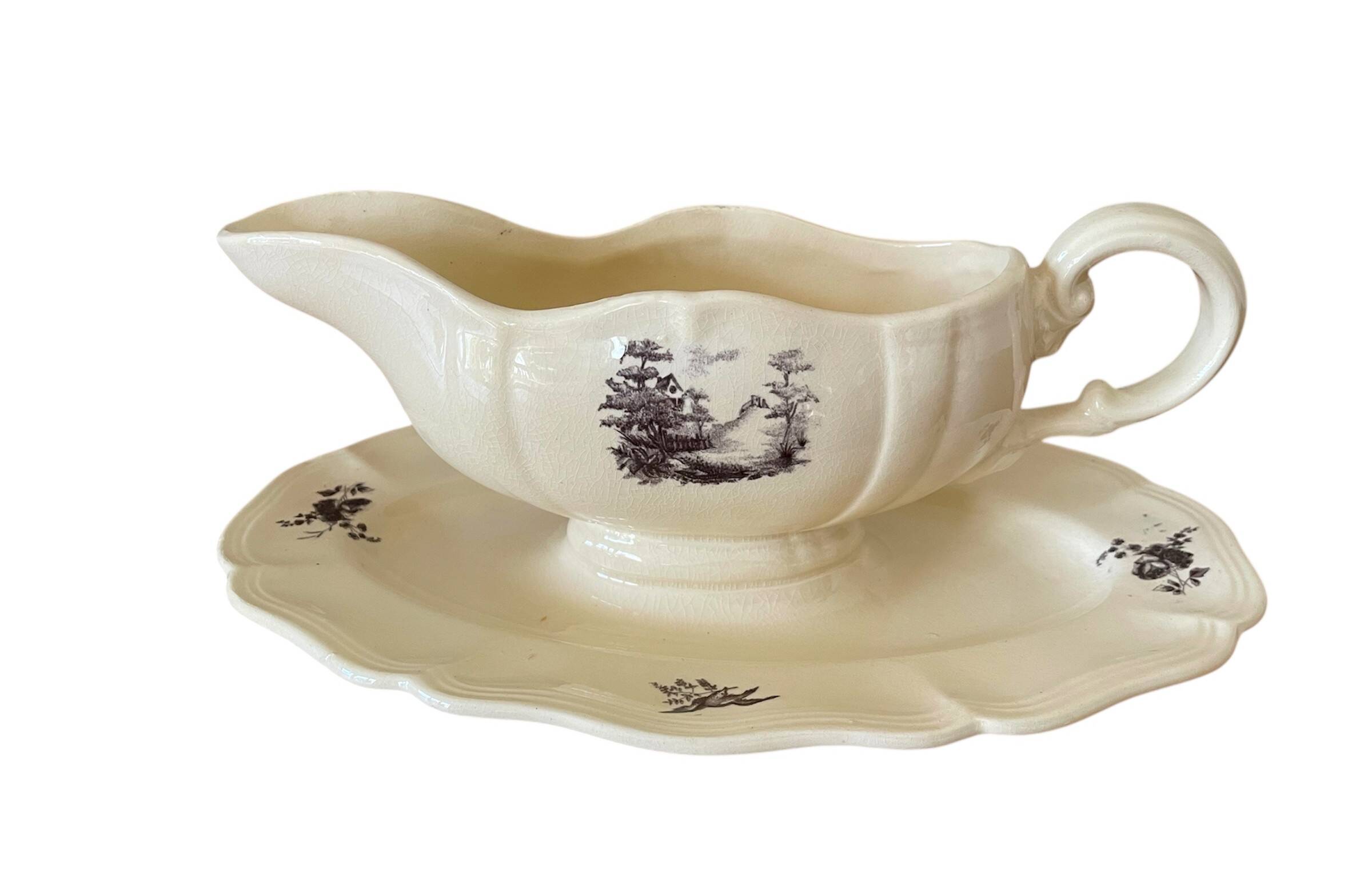 Antique sauce boat in Sarreguemines earthenware.