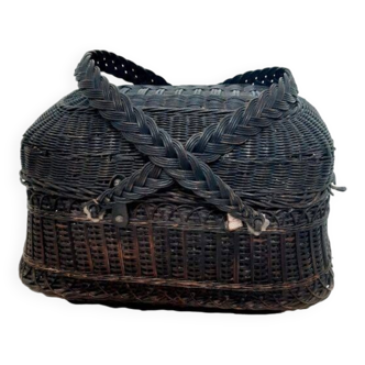 Old oval wicker basket with lid