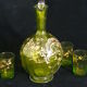Small carafe and green glass drop glasses with rococo golden emailed decor