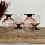 4 pink glasses with black stems