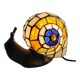 Tiffany-style lamp in the shape of a snail.