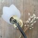 Table lamp with glass globe and brass foot