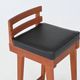 Erik Buck set of three bar stools in teak and leather Dyrlund Denmark 1960