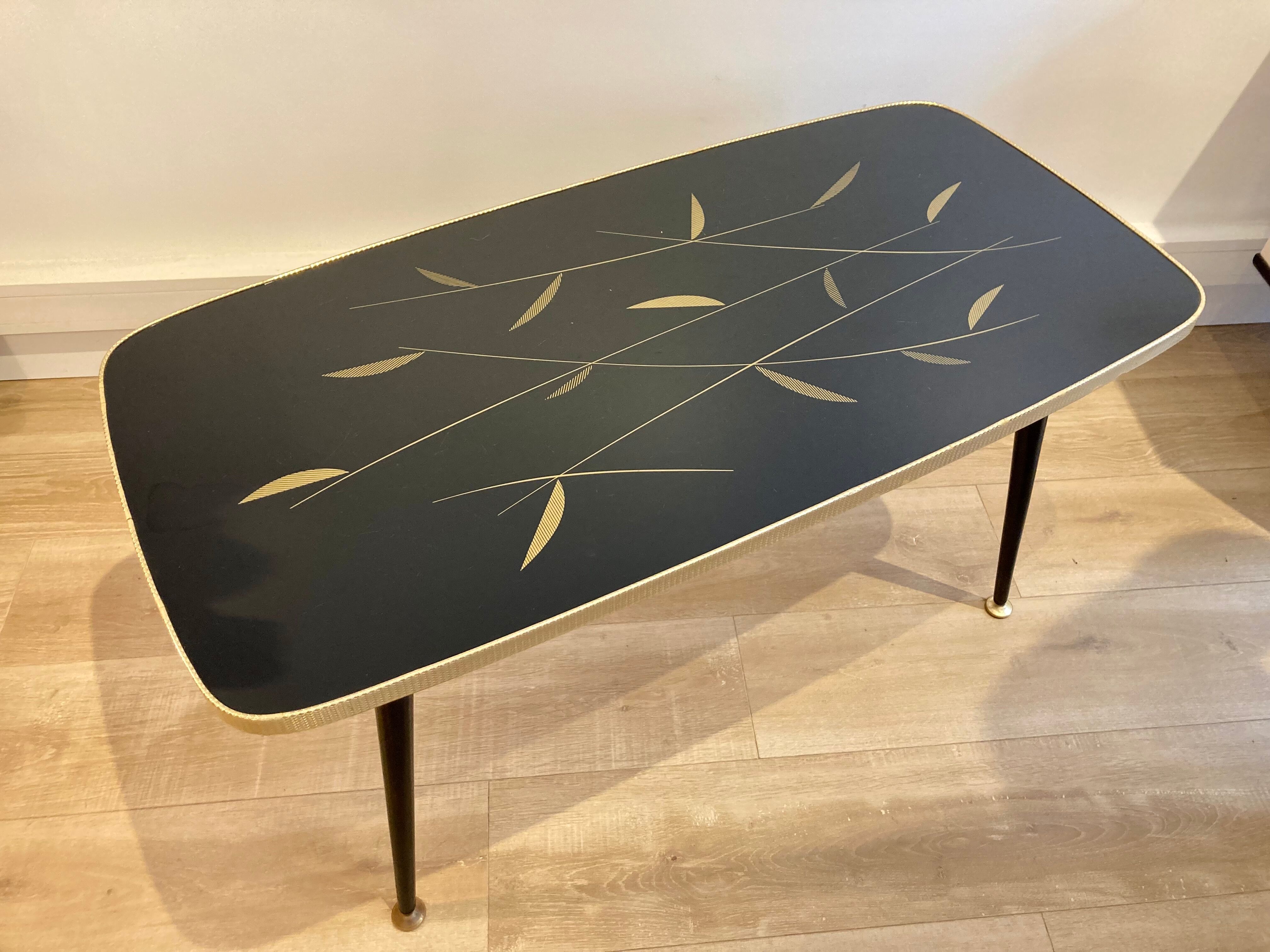 Black glass coffee table wooden legs 60s