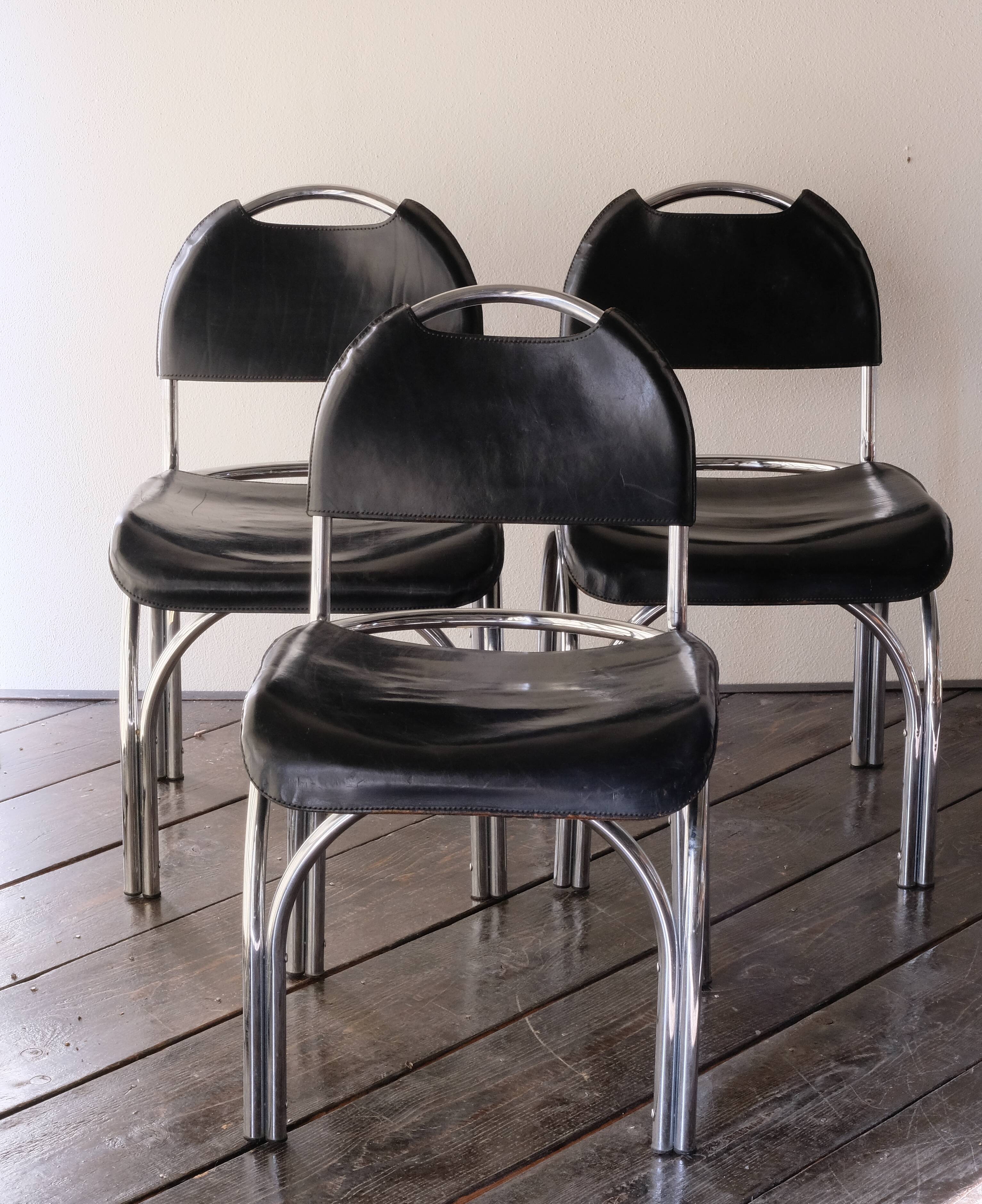 Chairs in black leather, '70