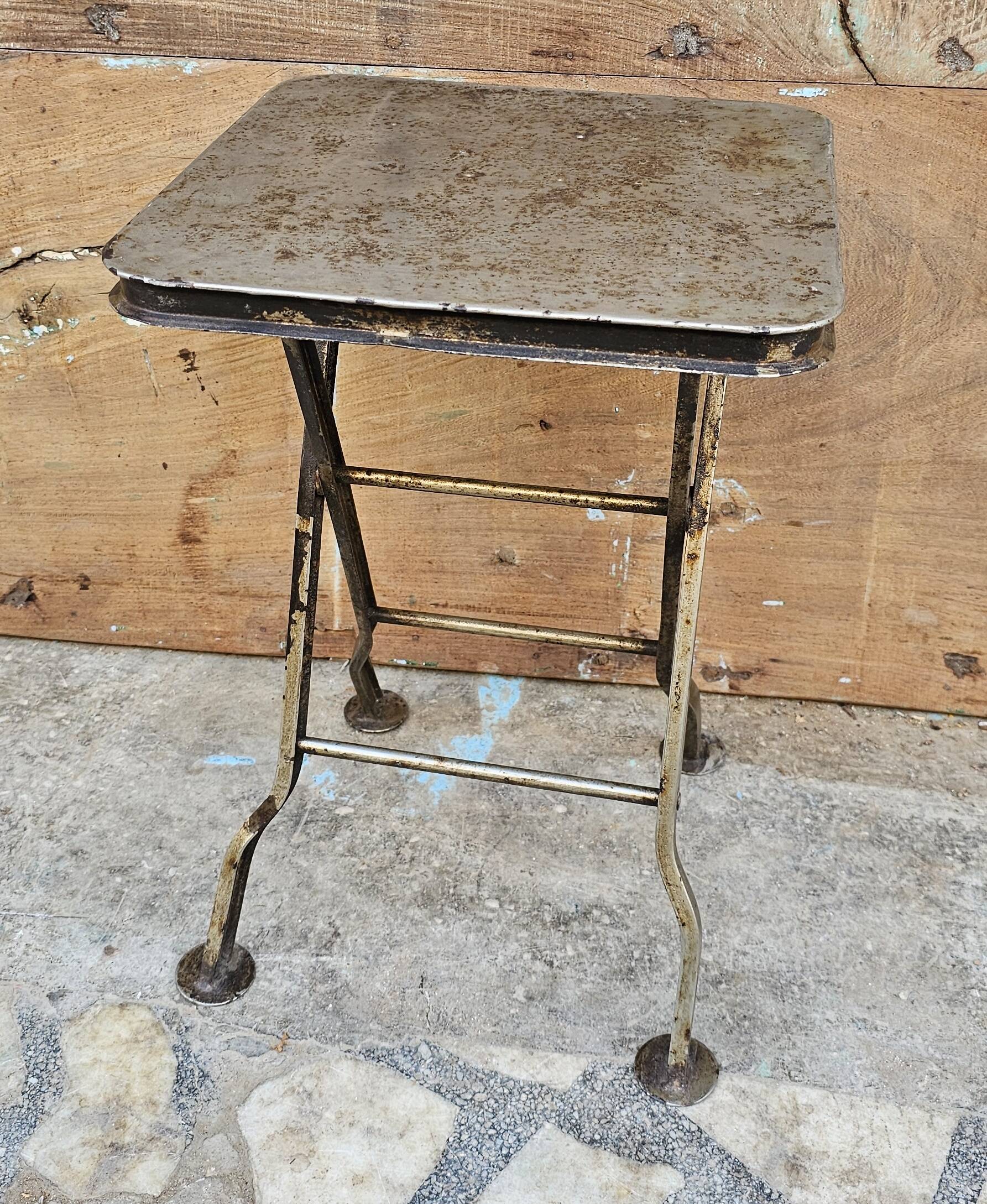 Old industrial folding steel stool