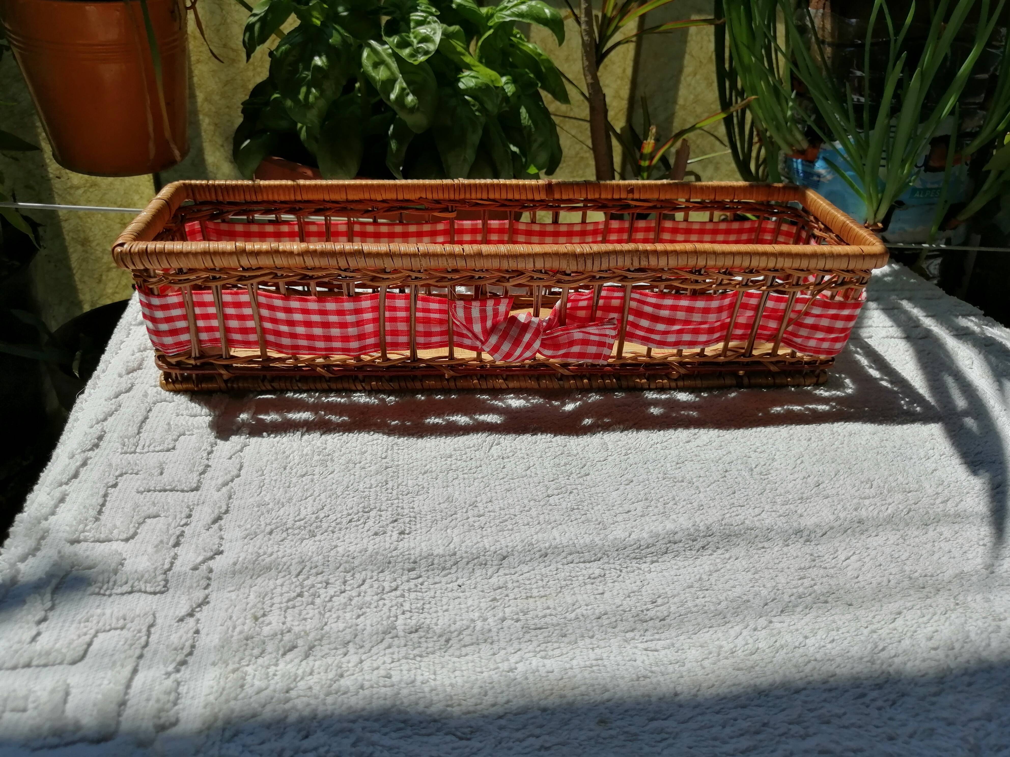 Basket in rattan or Wicker and vintage red gingham fabrics