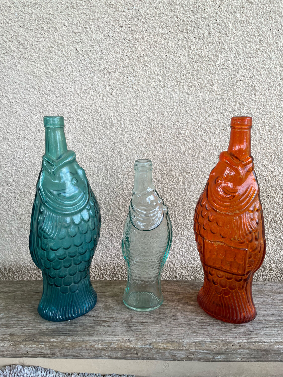 3 glass bottle fish