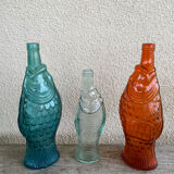 3 glass bottle fish